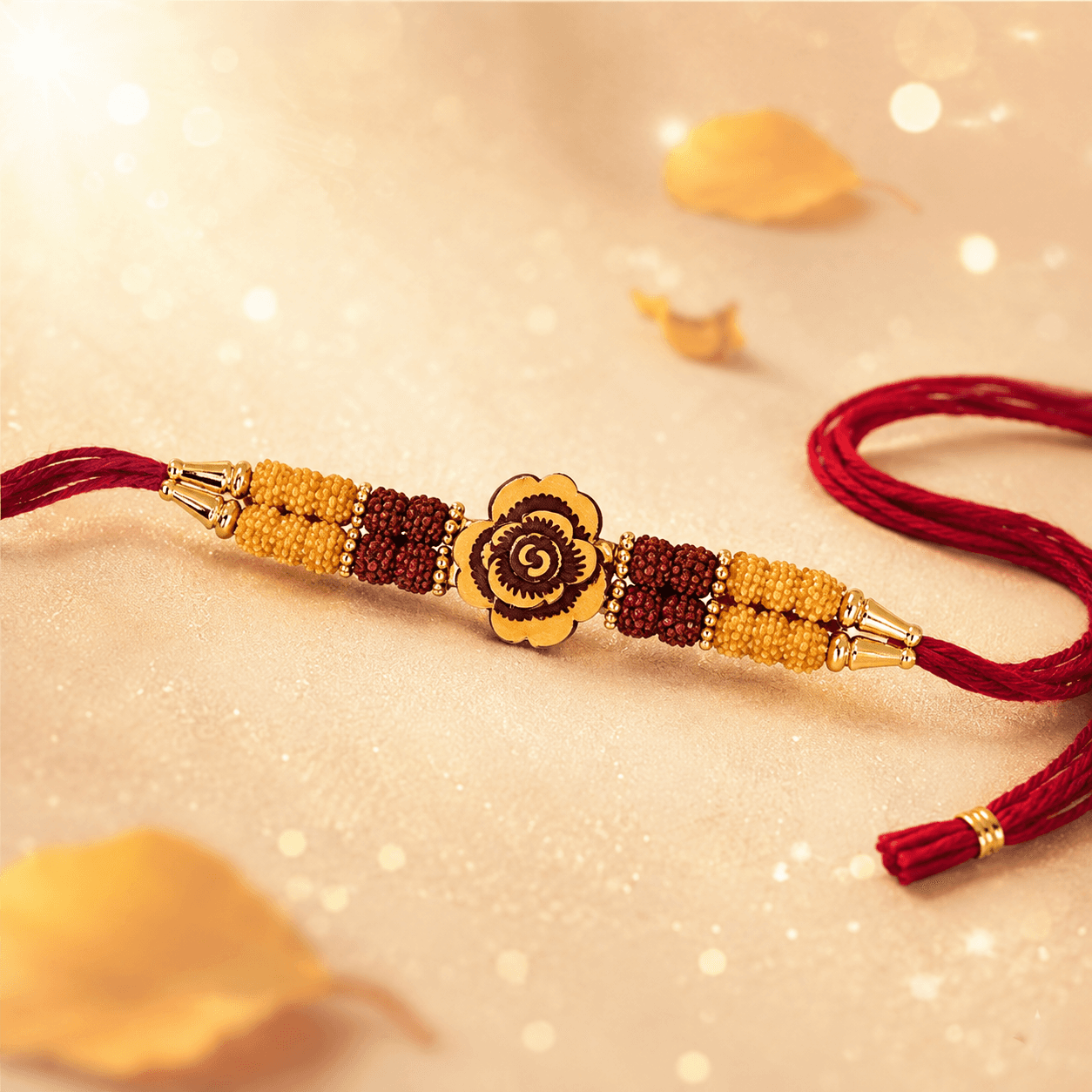 Rudraksha Gulab Rakhi — Gold Rose with Sacred Rudraksha Beads